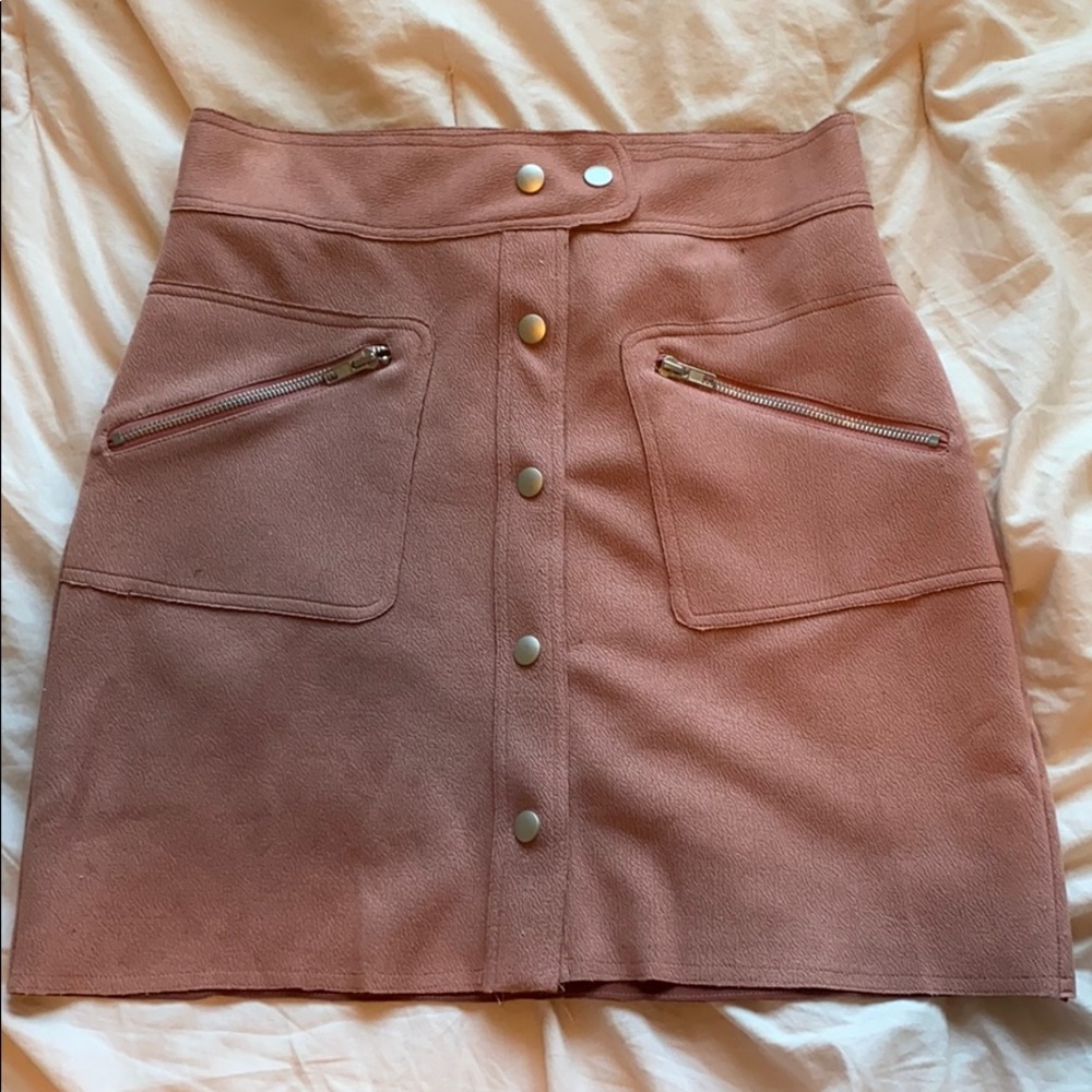 Lightly worn pink mini skirt with buttons